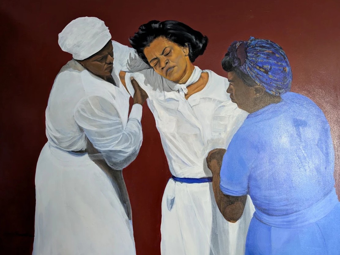Acrylic painting by Kurt Garrett of three women in white and blue against a deep red ground, supporting one another in prayer.
