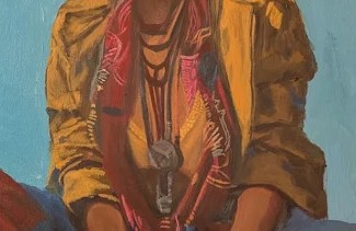 Detail of the patterned scarf and pendant at the chest.