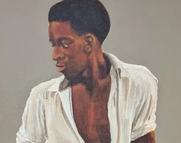 Detail of the young man's face and expression.